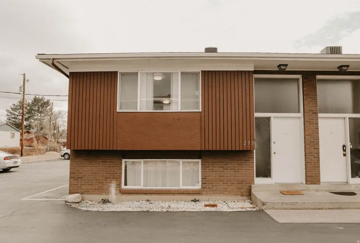 View of front of house featuring brick siding