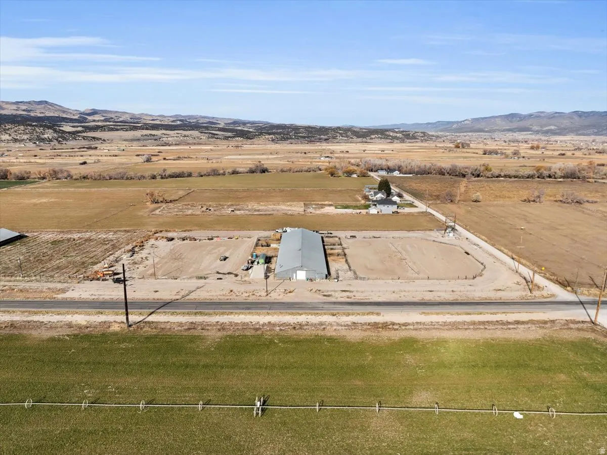 Aerial view of sparsely populated area featuring a mountainous background