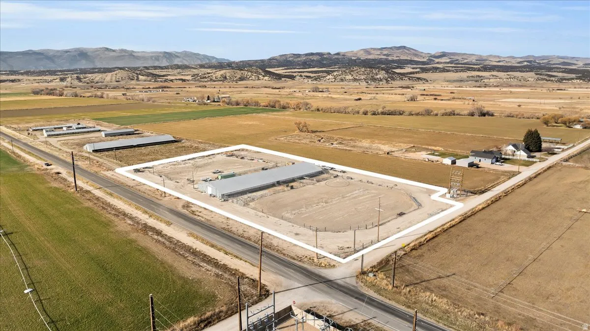 Aerial view of sparsely populated area with a mountain backdrop