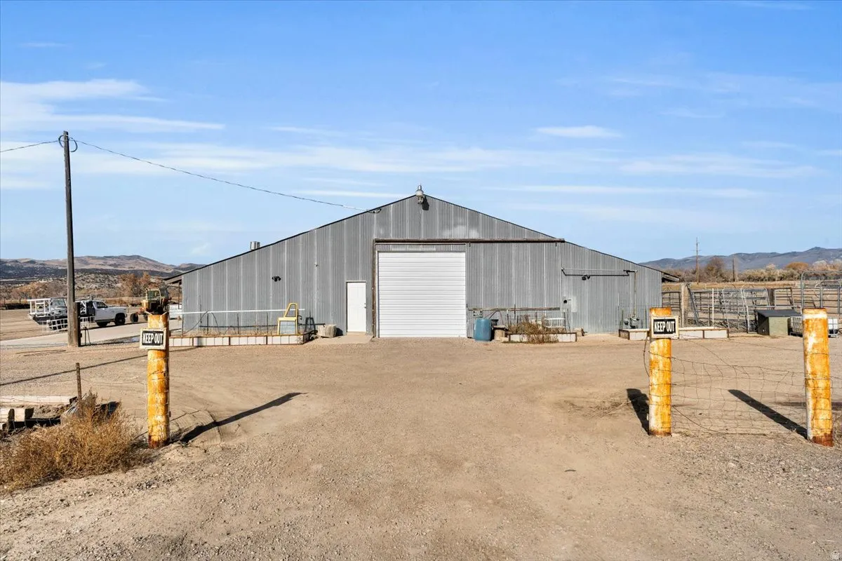 View of pole building featuring driveway and a mountain view