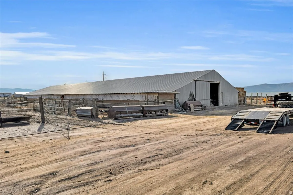 View of yard featuring an outdoor structure, an outbuilding, and a mountain view