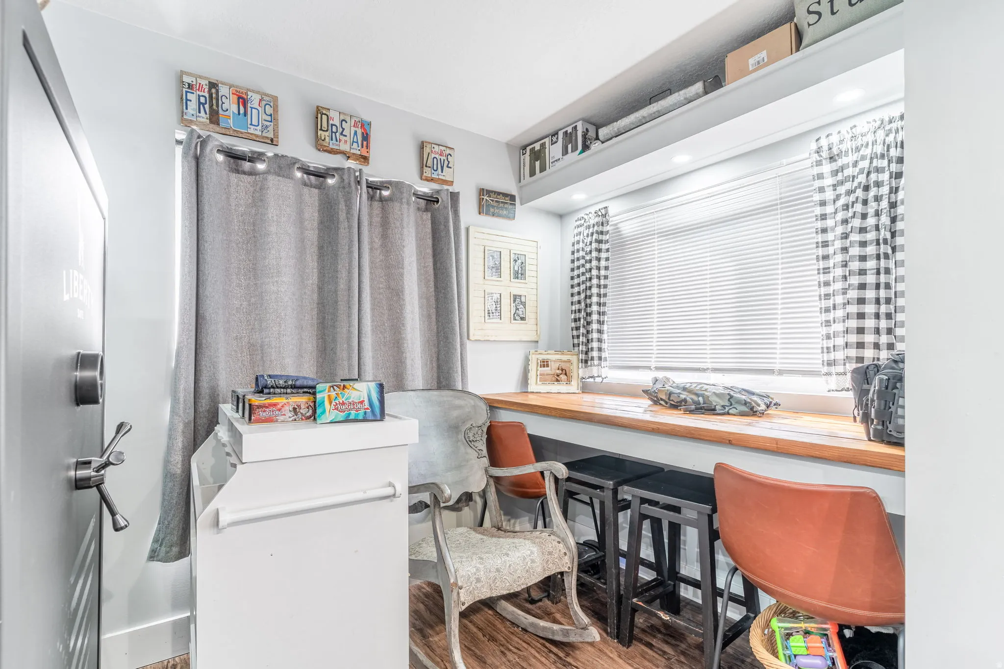 Laundry room with wood finished floors