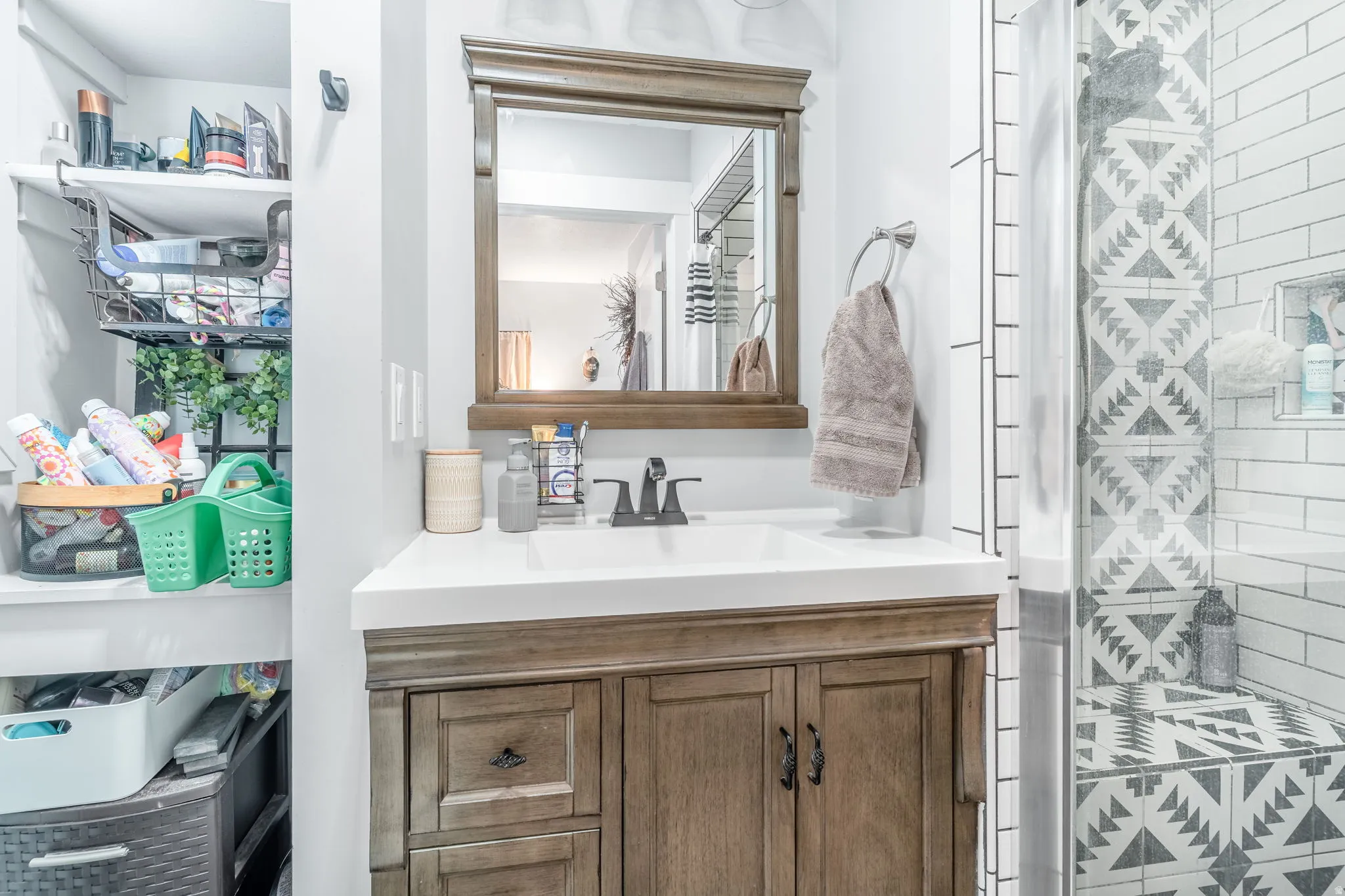 Bathroom with vanity and a shower stall