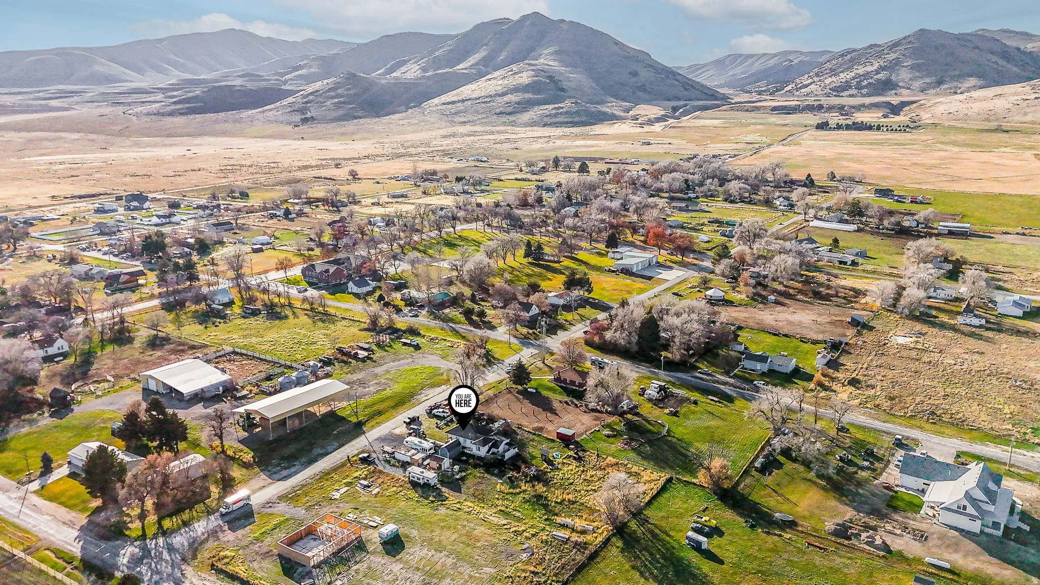 Aerial overview of property's location with a mountain backdrop