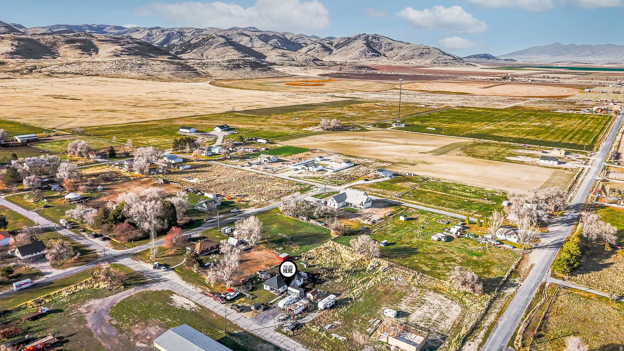 Aerial overview of property's location with mountains and rural landscape