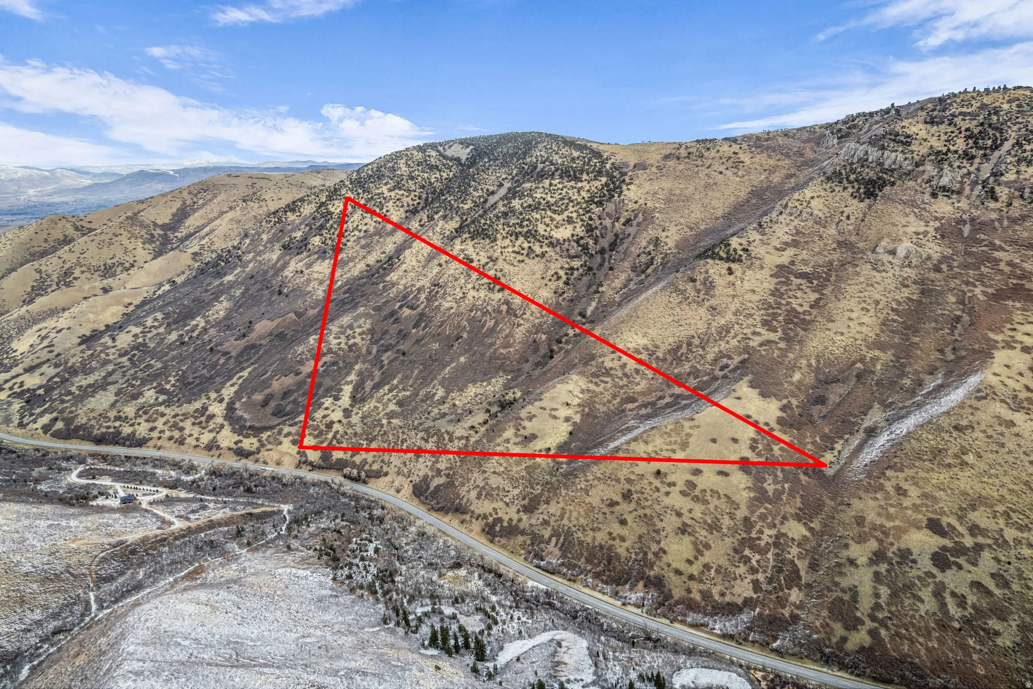 View of property location with property parcel outlined and a mountain backdrop