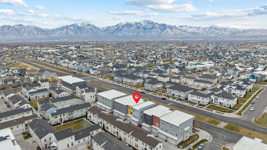 Aerial view of residential area featuring mountains