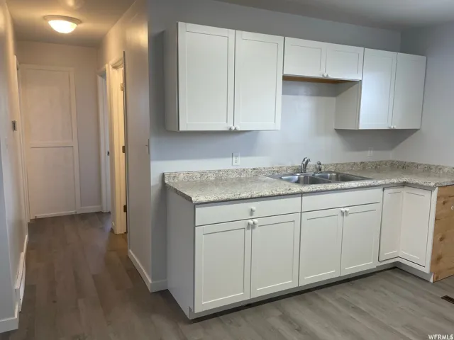 Kitchen & Hallway looking towards both bedroom doors