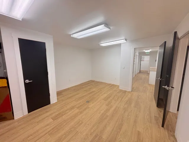 Spare room featuring light wood-style flooring