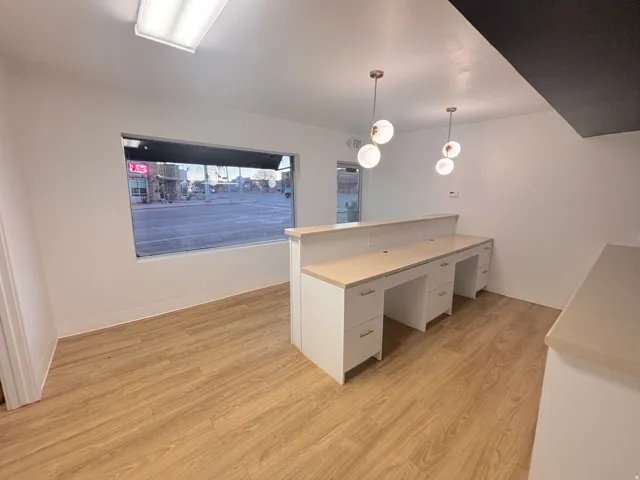 Unfurnished office featuring light wood finished floors
