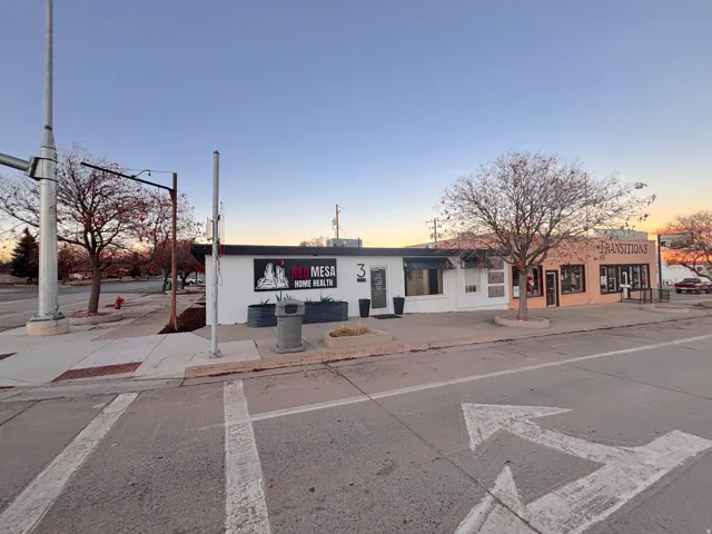 Property at dusk with view of commercial area