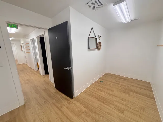 Hallway with light wood finished floors