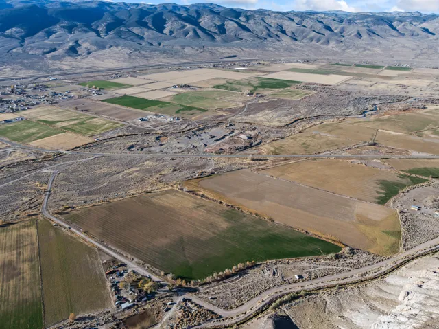 Overview of rural landscape featuring a mountain backdrop