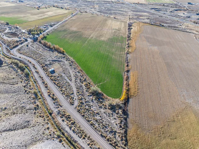 Aerial view of property's location with rural landscape and extensive farmland