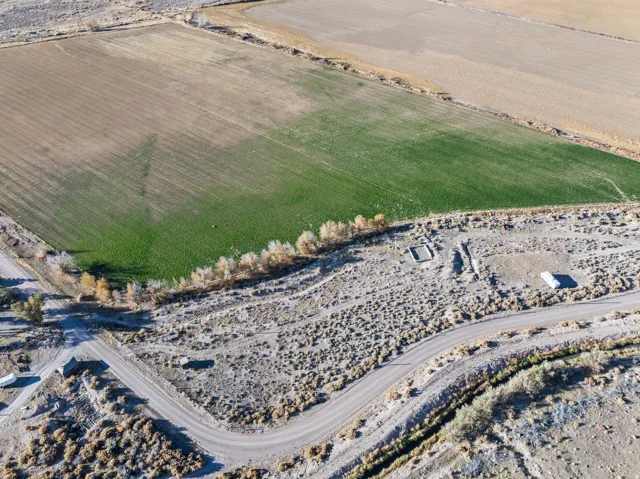 Aerial overview of property's location featuring rural landscape and abundant farmland