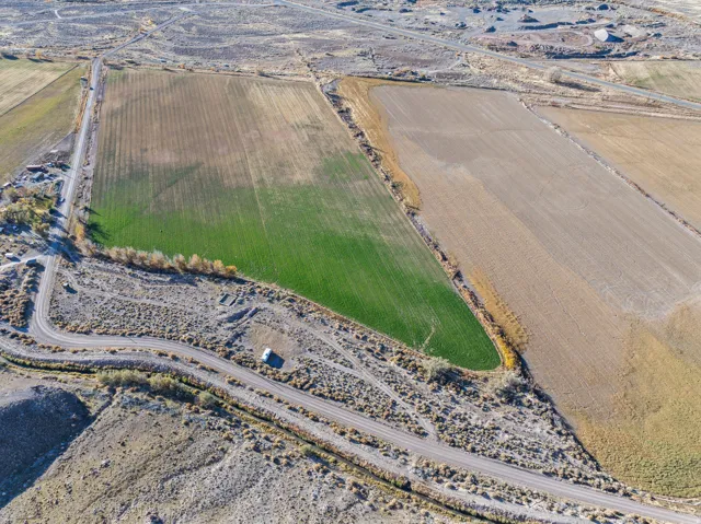 Aerial view of property's location with rural landscape and large plots for crops
