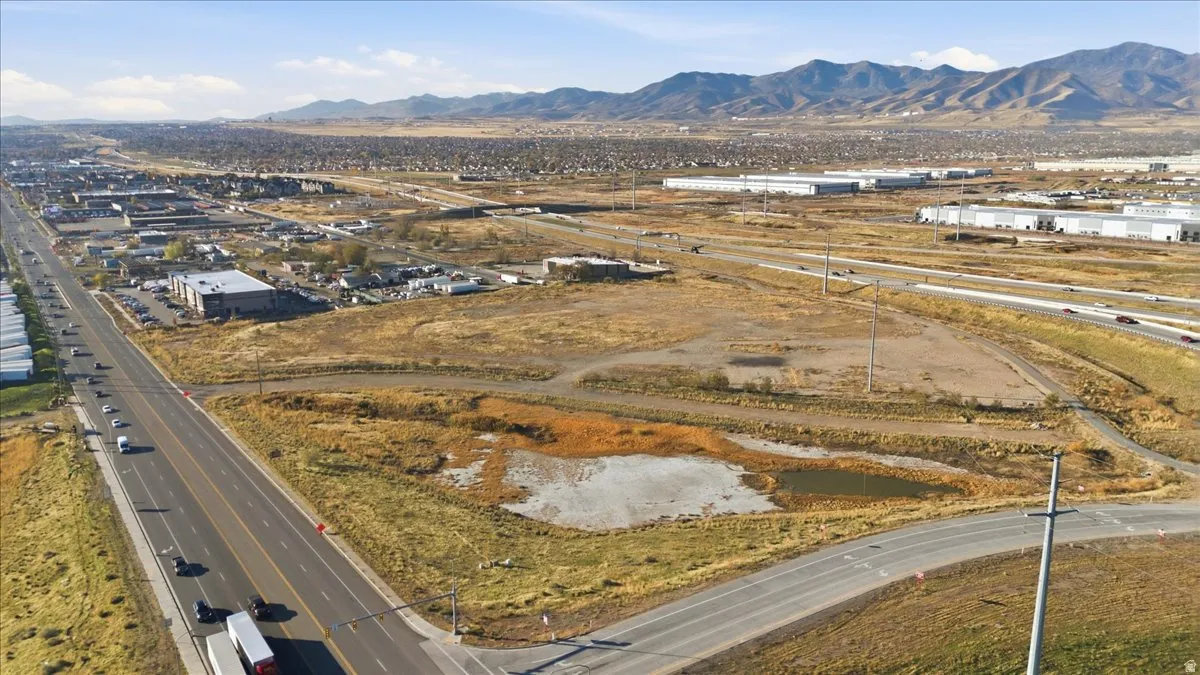 Drone / aerial view of a mountainous background and a main thoroughfare