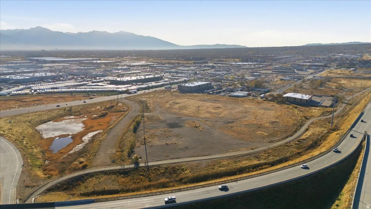 Aerial view of property's location with a mountainous background