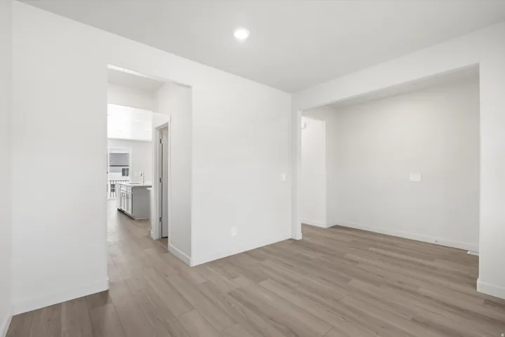 ***DISCLAIMER** Exterior & Interior finishes may vary. Spare room with light wood-style flooring and recessed lighting