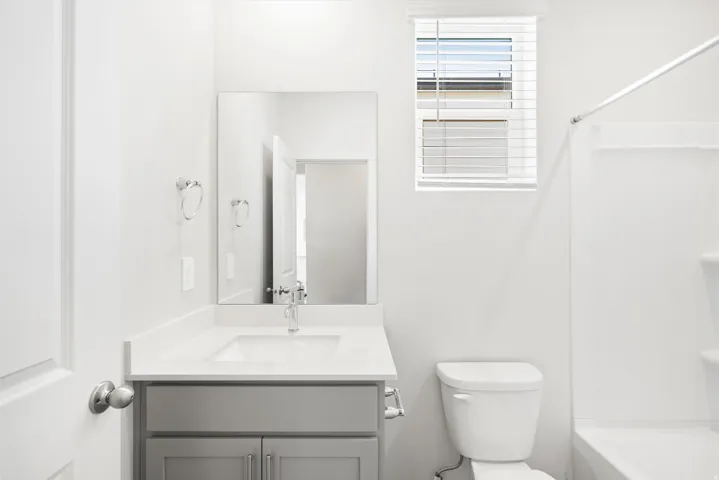 ***DISCLAIMER** Exterior & Interior finishes may vary. Bathroom with vanity and bathing tub / shower combination
