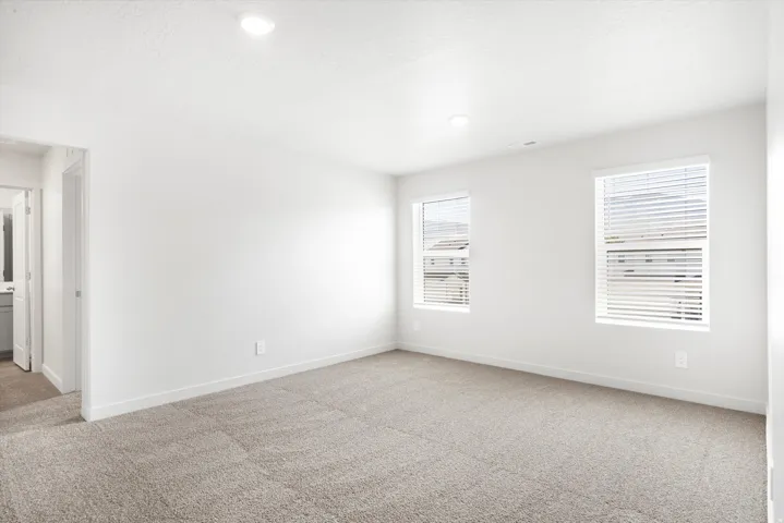 ***DISCLAIMER** Exterior & Interior finishes may vary. Spare room with light carpet, recessed lighting, and a textured ceiling