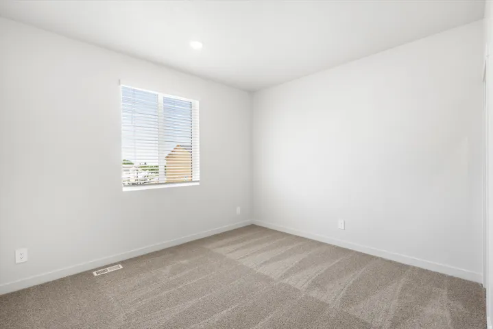 ***DISCLAIMER** Exterior & Interior finishes may vary. Empty room featuring carpet floors and recessed lighting