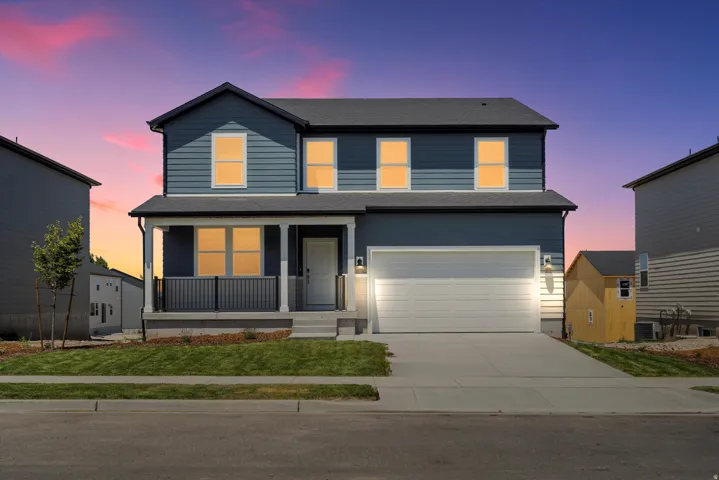 ***DISCLAIMER** Exterior & Interior finishes may vary. View of front facade featuring a porch, driveway, a garage, and roof with shingles