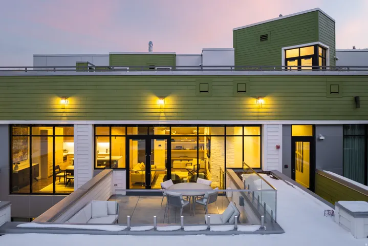 Rear view of property featuring a patio and outdoor dining space