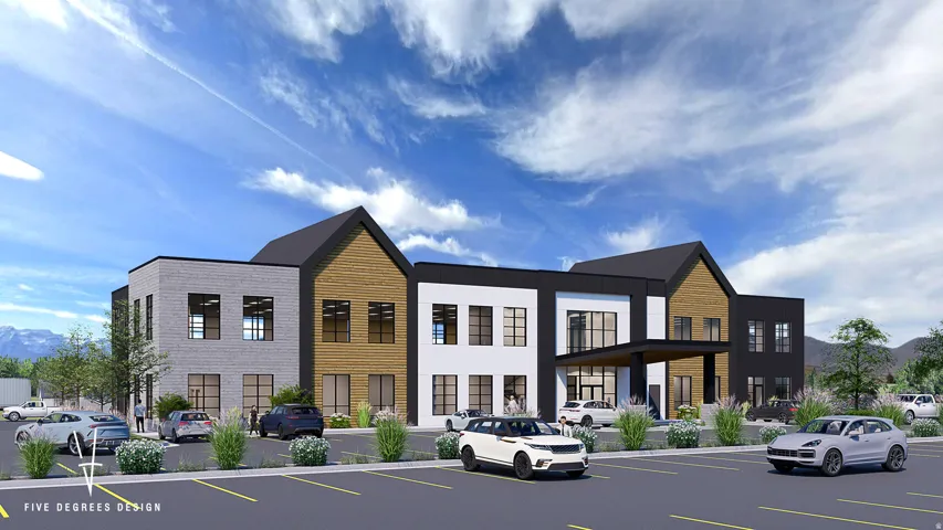 View of property featuring uncovered parking