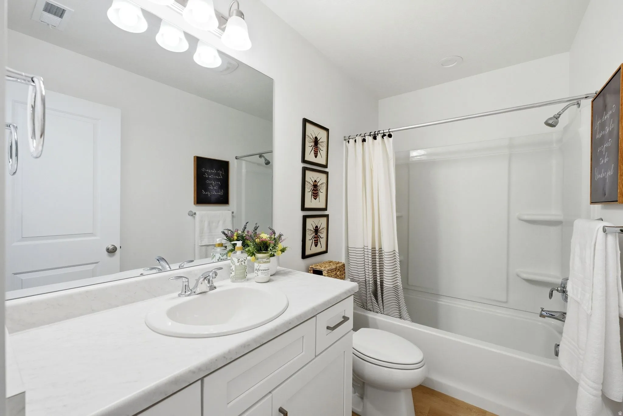 Full bathroom with vanity and shower / bath combo