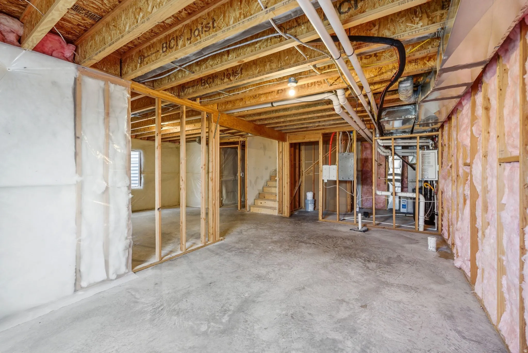 Below grade area with stairs and electric panel