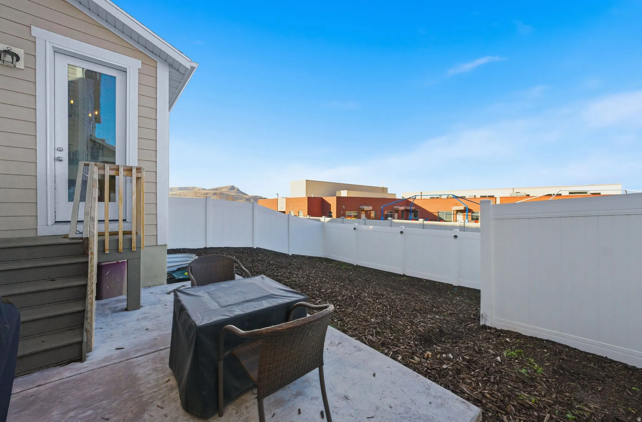 Fenced backyard featuring a patio area