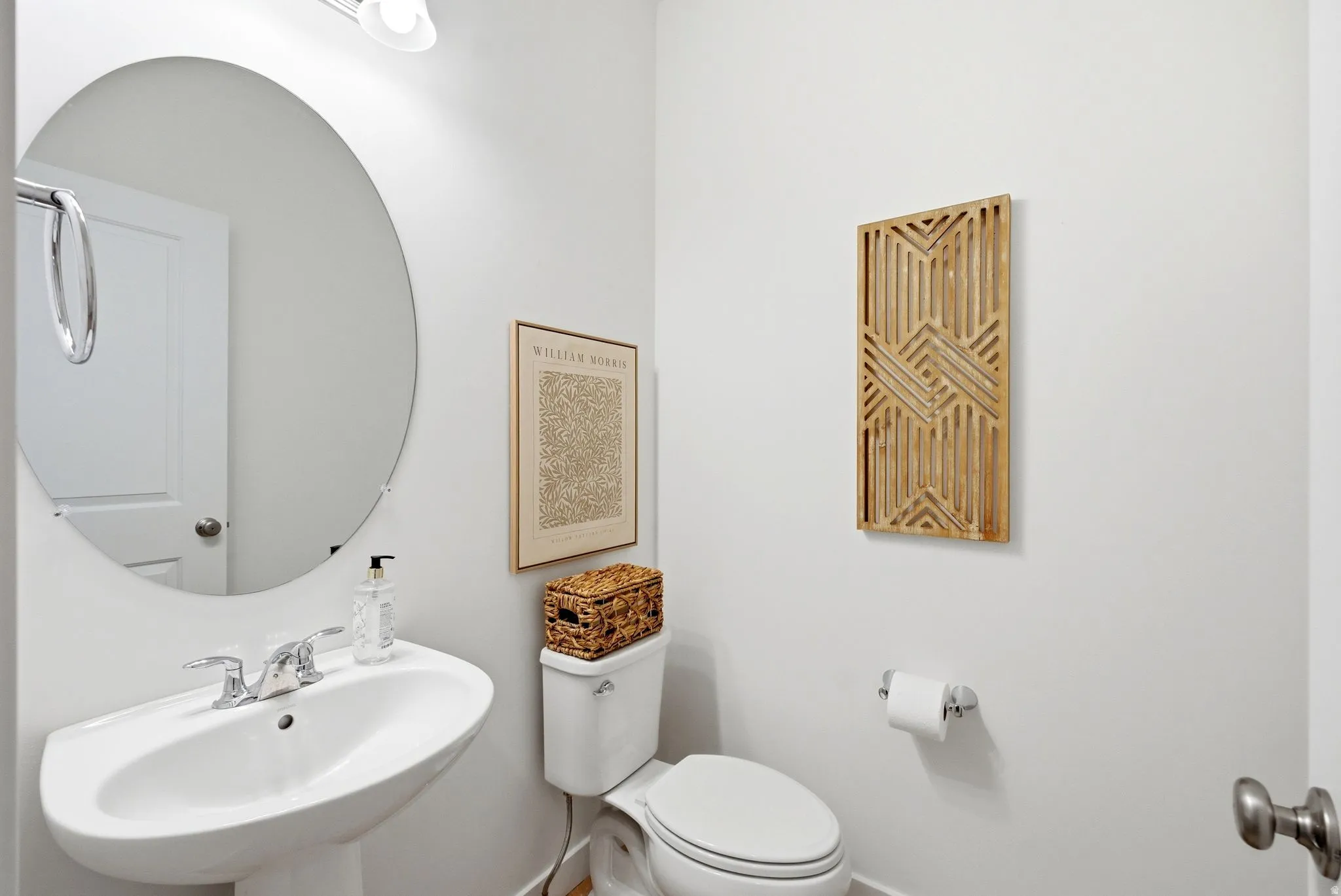 Half bathroom featuring toilet and a sink