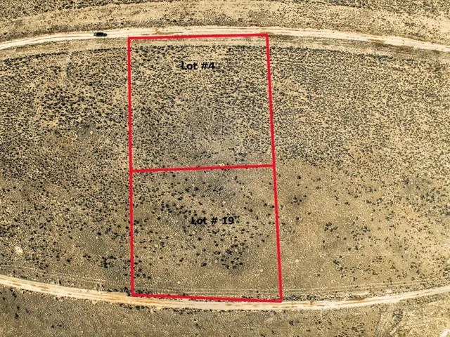 Aerial view of sparsely populated area with a desert landscape and property boundaries highlighted
