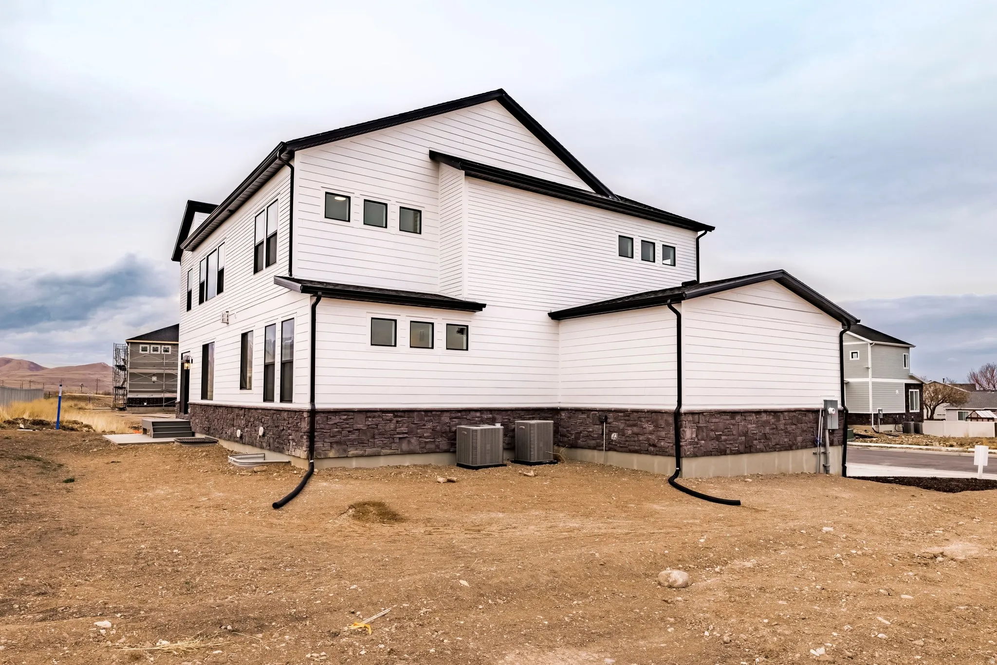 View of property exterior with a central air condition unit