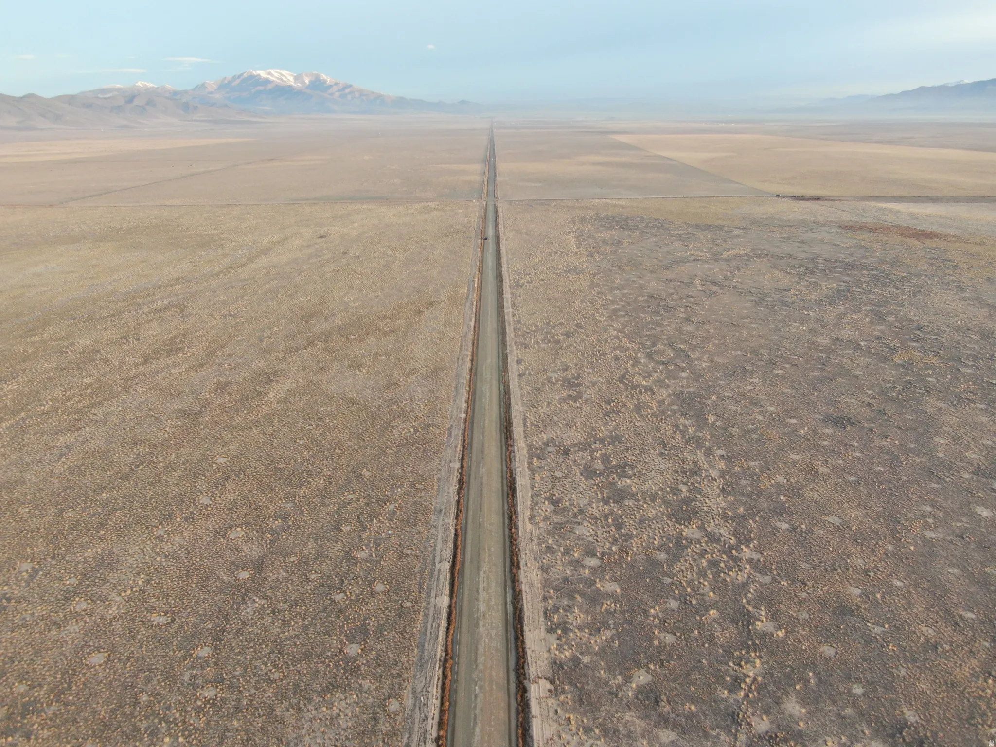 Overview of rural landscape with a mountain backdrop