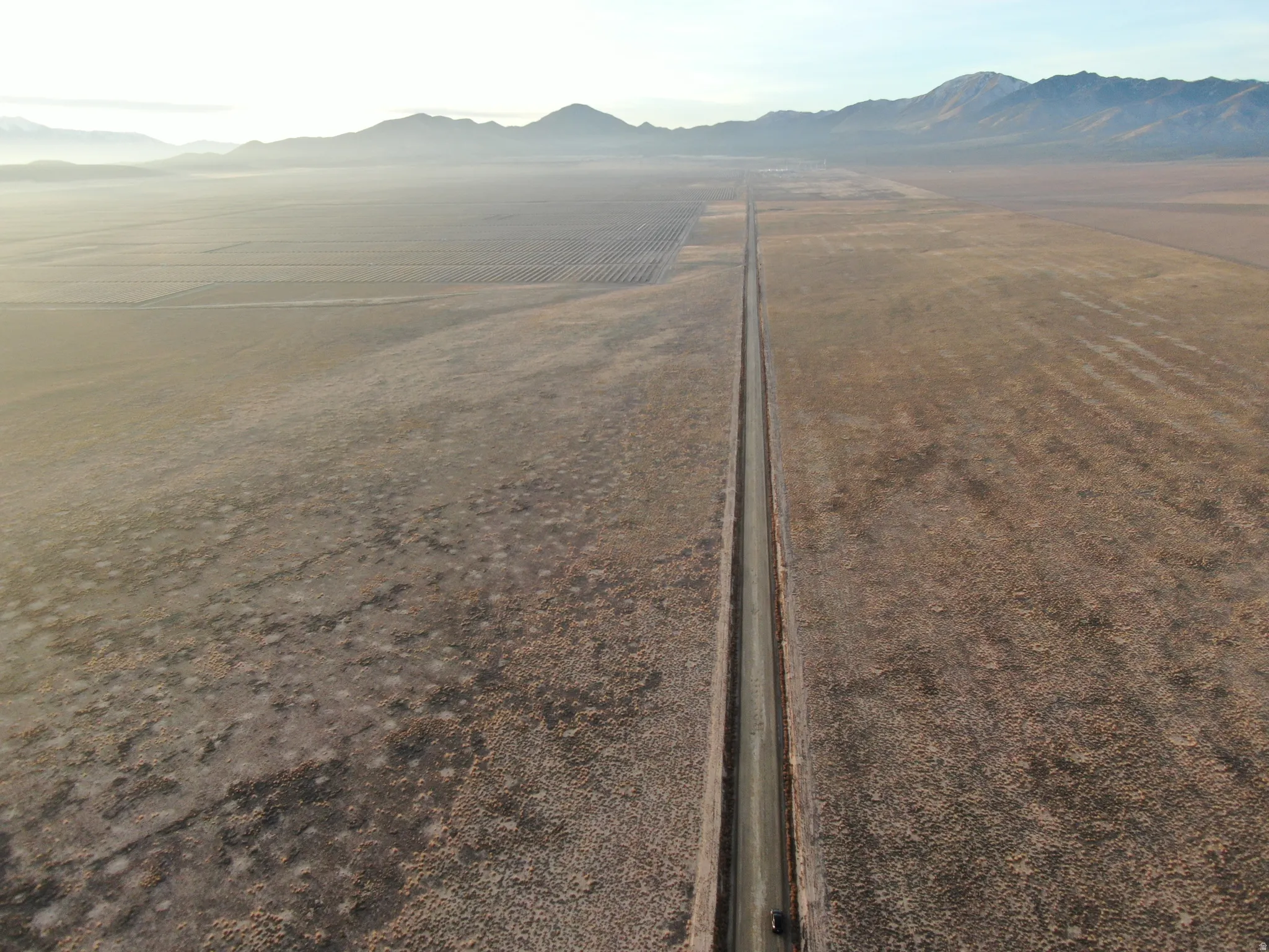 View of mountain backdrop with rural landscape and abundant farmland
