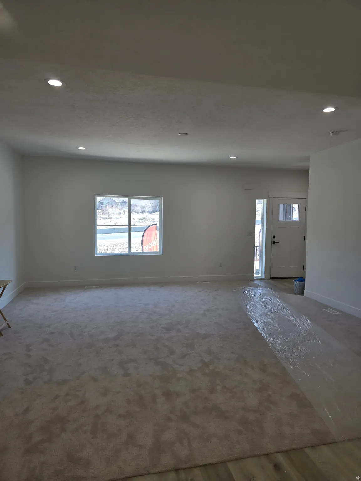 Living room featuring plenty of natural light and recessed lighting
