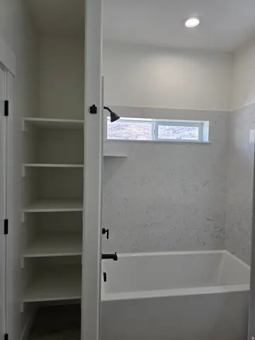 Full bathroom with tub / shower combination and recessed lighting
