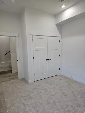 Bedroom featuring a closet, carpet, and recessed lighting
