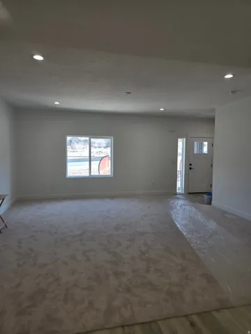 Living room featuring plenty of natural light and recessed lighting