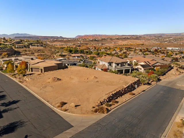 Aerial perspective of suburban area featuring a mountain backdrop