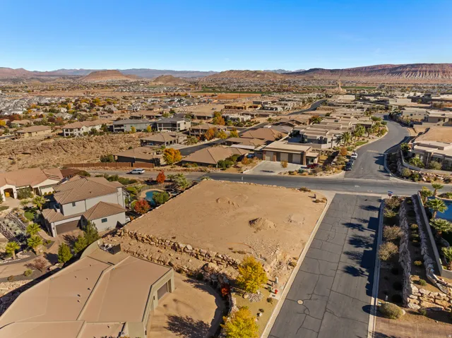 View of property location featuring mountains and nearby suburban area
