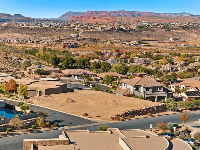 Aerial perspective of suburban area featuring a mountain backdrop