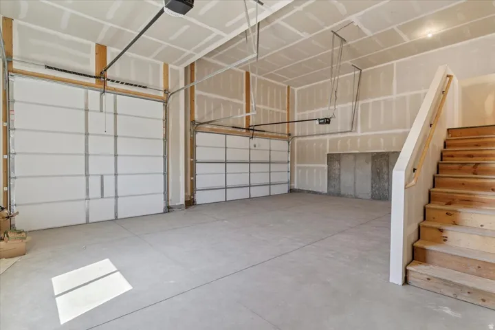 Garage featuring a garage door opener