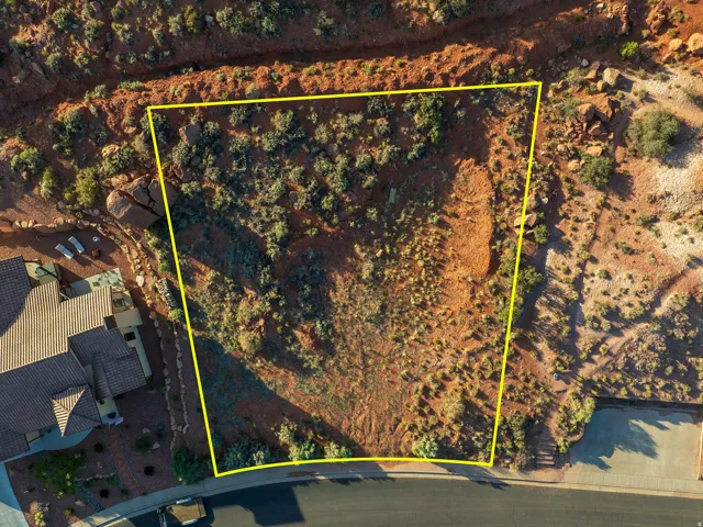 Aerial view of property and surrounding area featuring property parcel outlined