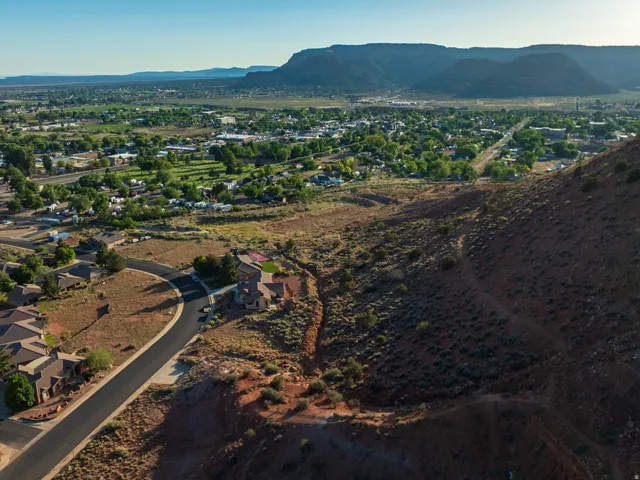 Aerial overview of property's location featuring a mountain backdrop