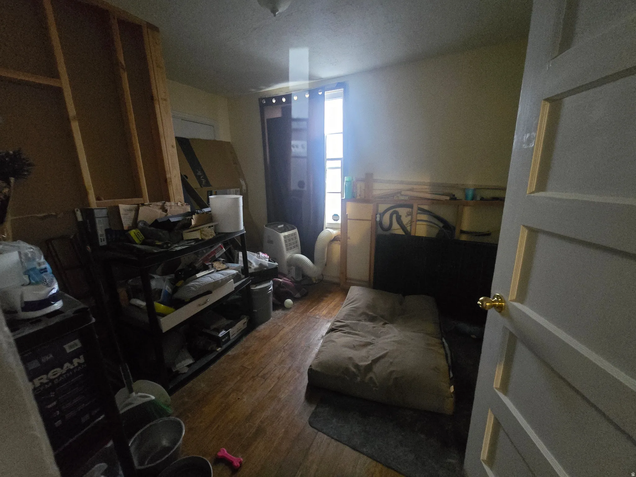 Bedroom featuring dark wood-style floors