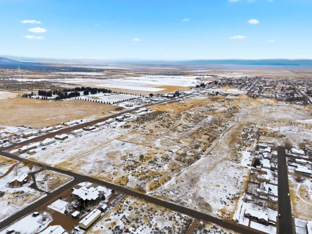 Snowy aerial view with a residential view