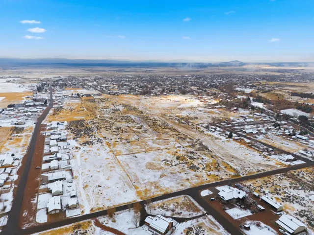 Snowy aerial view with a residential view